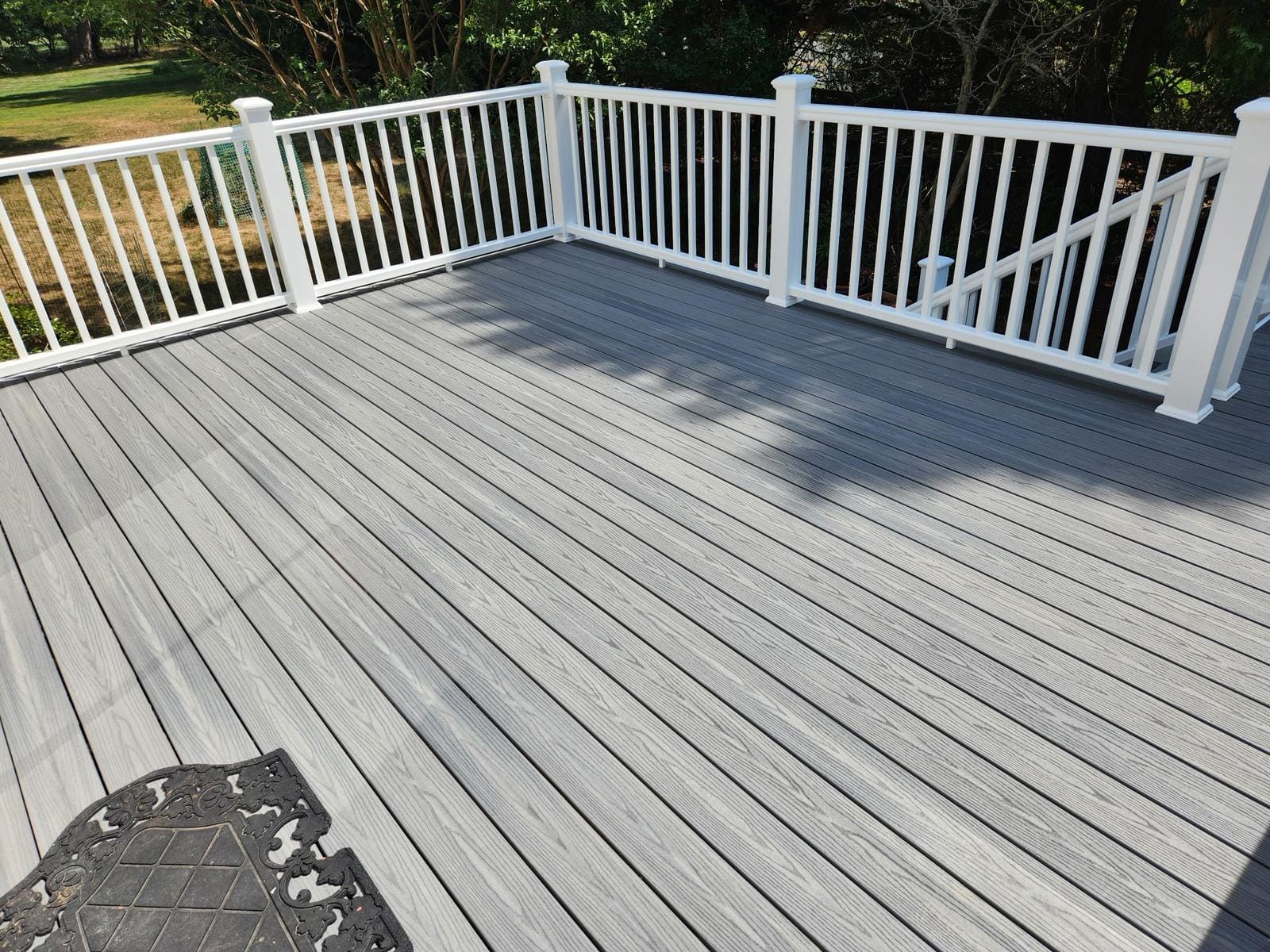 A newly built backyard deck on a Vienna, VA home by Skip's Modern Carpentry