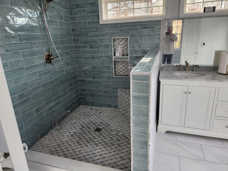 Renovated bathroom with tiled walk-in shower